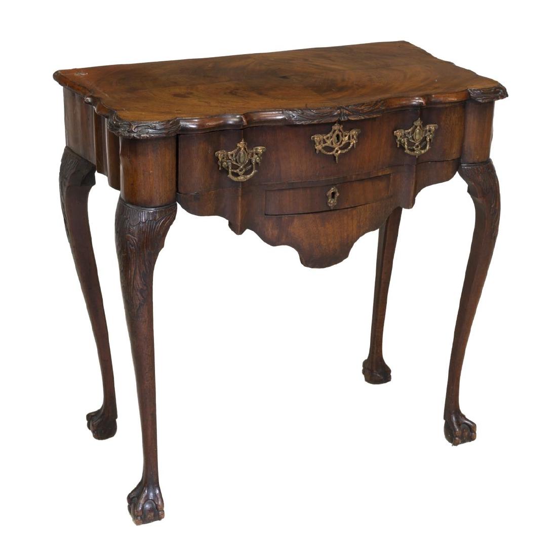 CHIPPENDALE STYLE MAHOGANY TALON & BALL TEA TABLE: Chippendale style tea table, 18thc., the shaped matched mahogany veneer top, surmounting a large shaped drawer and smaller drawer, raised on long cabriole supports, ending in a talon and ball foot, to