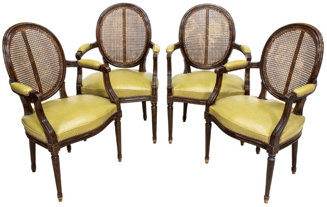 (4) FRENCH LOUIS XVI STYLE FAUTEUIL ARMCHAIRS: (lot of 4) French Louis XVI style fauteuil chairs, 20th c., the circular cane back over seat with leather-like upholstery and nail head accents, having padded arm rests, rising on fluted legs, approx 