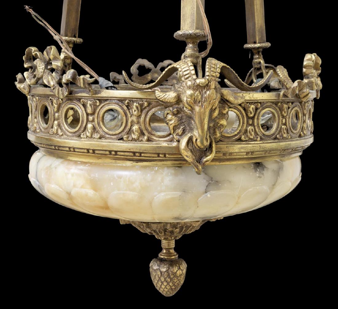 BRONZE & ALABASTER THREE-LIGHT CHANDELIER: Bronze and alabaster three-light chandelier, having three descending standards supporting an alabaster bowl, encasing three lights, accented by bronze band with ram's head and ribbon elements, center 