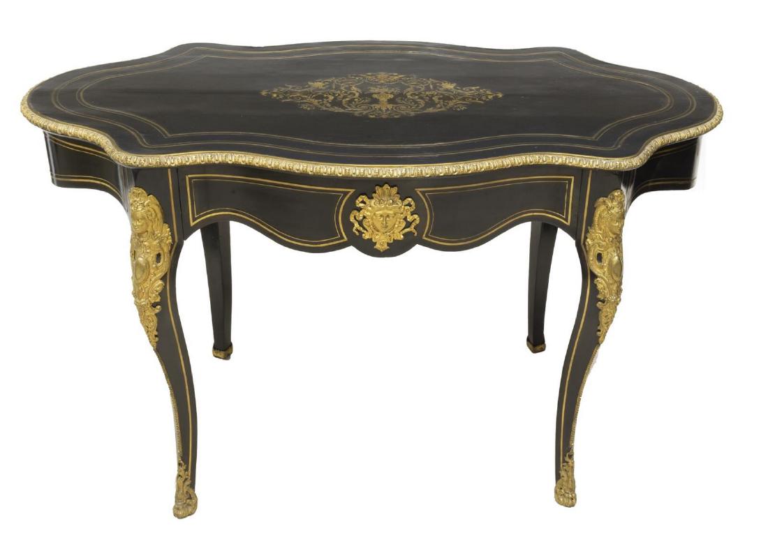LOUIS XV STYLE ORMOLU MOUNTED EBONIZED BUREAU PLAT: Louis XV style ebonized bureau plat, having banded top with gilt metal string inlay, central Boulle work cartouche with urn and scrolling foliates, fitted with a single frieze drawer with mask, raised