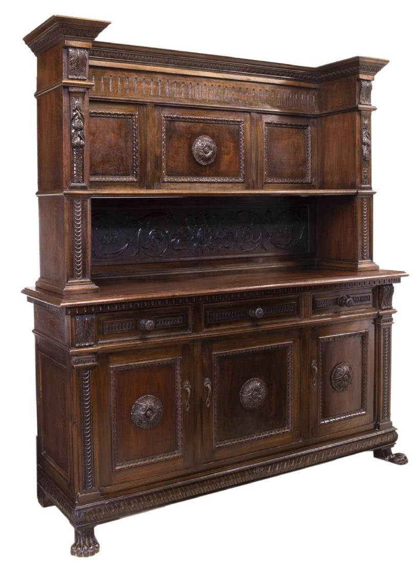CONTINENTAL RENAISSANCE REVIVAL WALNUT BUFFET: Continental Renaissance Revival walnut buffet, early 20th c., carved with running ornamentation, rosettes and foliate motifs, having upper shelf, above three drawers, three doors opening to lower cabi