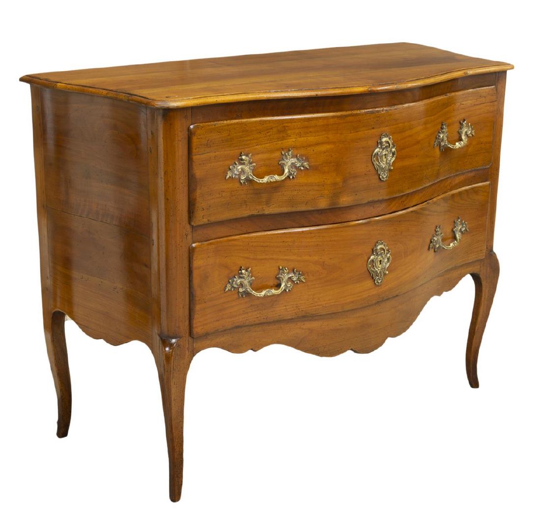 FRENCH LOUIS XV STYLE FRUITWOOD COMMODE: French Louis XV style fruitwood commode, 19th c., the shaped top over two drawers, having gilt metal accents, rising on cabriole legs, approx 35"h, 47"w, 22"d Start Price: $800.00