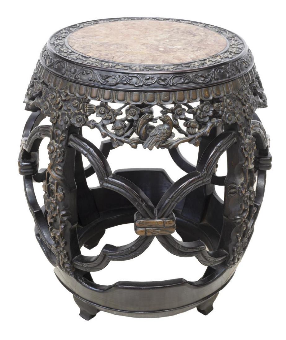 CHINESE MARBLE-TOP HARDWOOD GARDEN STOOL STAND: Chinese hardwood garden stool/ stand, in ebonized finish, with inset marble top, cylindrical drum-form body, with carved floral blossom and trellis motif, rising on shaped feet, approx 20.75"h, 17"dia