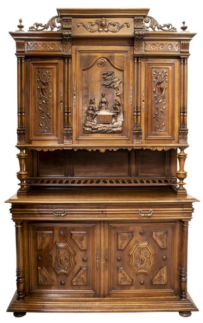 FRENCH RENAISSANCE REVIVAL CARVED SIDEBOARD: French Renaissance Revival walnut sideboard, 19th c., the protruding cornice over a central door with carved Bruegel figures flanked by turned columns and a single door at each side, the lower part wi