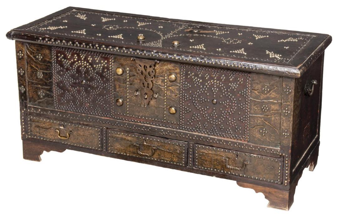 MIDDLE EASTERM METAL CLAD & TACKED STORAGE CHEST: Middle Eastern metal clad storage trunk, 19thc, geometric and stylized tacked floral design to the top, surmounting metal clad facade with tacked design, iron hinge, interior trunk with side storage a