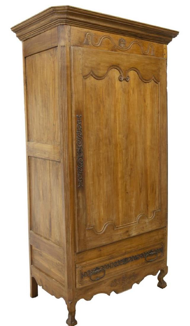 FRENCH LOUIS XV STYLE BONNETIERE: French Louis XV style bonnetiere, early 19th c., accented with foliate carving, a protruding cornice over two paneled doors with ornate lock plates, rising on cabriole legs, approx 90.5"h, 44"w, 25.75