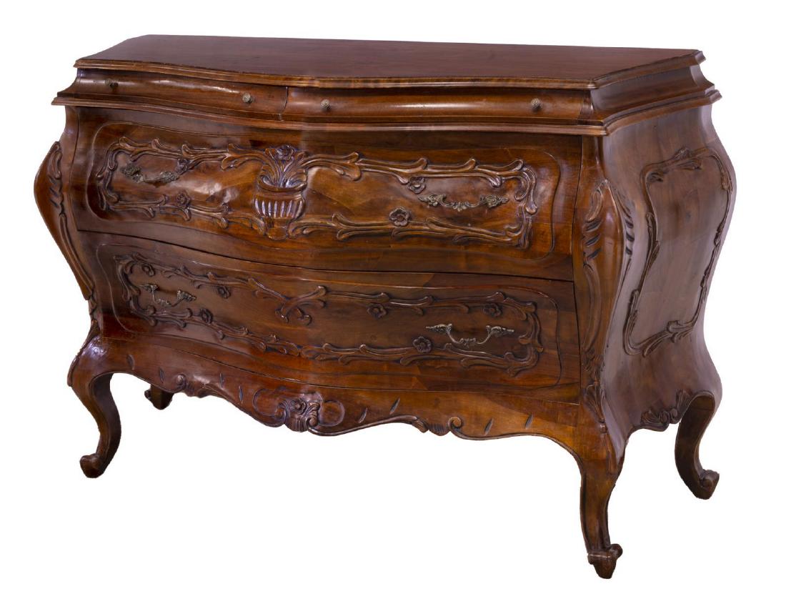 FRENCH LOUIS XV STYLE BOMBE COMMODE: French Louis XV style bombe commode, 20th c., accented with foliate press carving, two short drawers over two long drawers, all rising on scroll foot cabriole legs, 36.25"h, 57"w, 20"d **Provenance: F