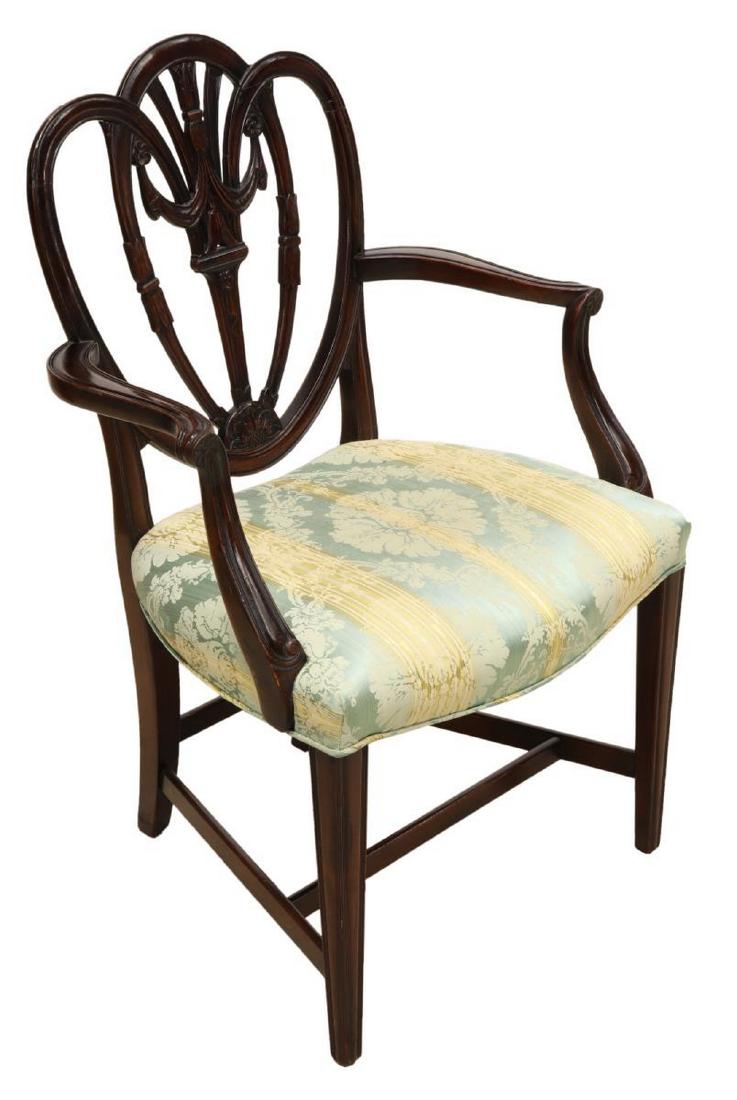 HEPPLWHITE STYLE CARVED ARM CHAIR: Hepplewhite style carved armchair, having worn upholstery on the padded seat, on a stretcher joined base, 38.5"h, 24.5"w, 18.5"d **Provenance: From the Estate of Huey Keeney of Tyler, Texas** Start Pr