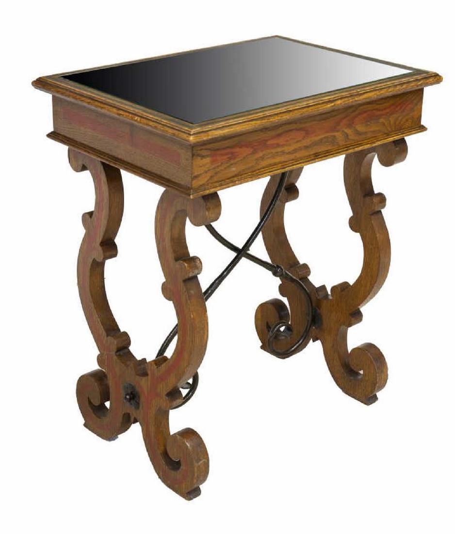 SPANISH BAROQUE STYLE MIRROR-TOP SIDE TABLE: Spanish Baroque style side table, 20th c., having inset mirrored top, on ox yoke trestle supports, joined by scrolled iron stretchers Start Price: $100.00