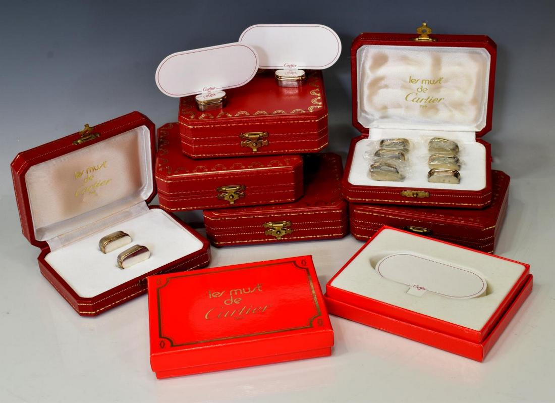 (16) CARTIER STERLING SILVER PLACE CARD HOLDERS: (lot of 16) Cartier sterling silver place card holders, in (six) fitted boxed, accompanied by (two) boxes of blank paper cards, approx 4.62ozt total (weighable silver only), for shipping purposes only