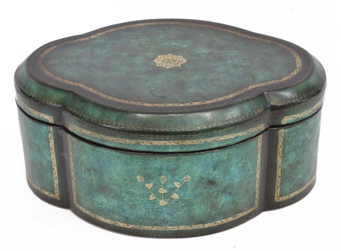 MAITLAND SMITH (ATTRIB.) LEATHER-CLAD DRESSER BOX: Dresser/ table box, late 20th c., attributed to Maitland Smith, leather-clad lobed form, variegated green reserves with gilt embossing, lift top, open interior lined with marbleized paper, approx 5"h,