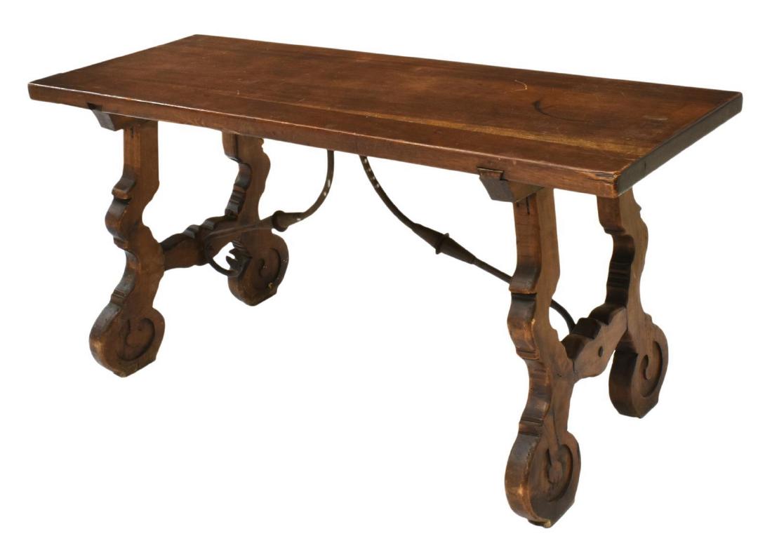 SPANISH BAROQUE STYLE WALNUT TABLE: Spanish Baroque style walnut table, having rectangular top, on ox yoke supports, joined by scrolled iron center stretcher, restoration to base, approx 20"h, 41.25"w, 18.25"d Start Price: $150.00