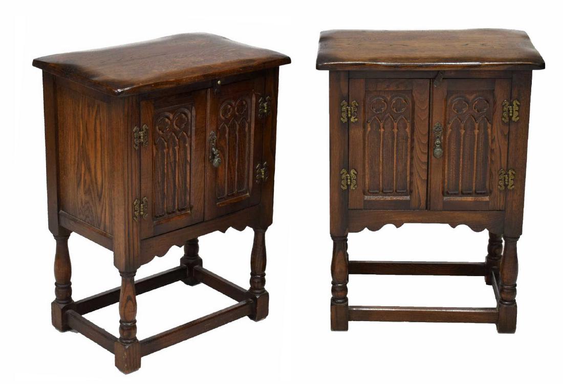 (PR) GOTHIC REVIVAL OAK BEDSIDE CABINETS: (pair) Gothic Revival oak bedside cabinets, 20th c., having single double door cabinet carved with quatrefoils and arches, enclosing open interior, rising on turned box stretcher joined legs, approx 2