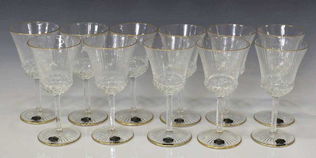 (11) ST. LOUIS CRYSTAL 'APOLLO GOLD' WATER GOBLETS: (lot of 11) Saint Louis Crystal water goblets, France, from the "Apollo Gold" pattern, the body and stem with subtle rib design, lip and foot with gold banded highlights, acid etched stamp, "Cristal S