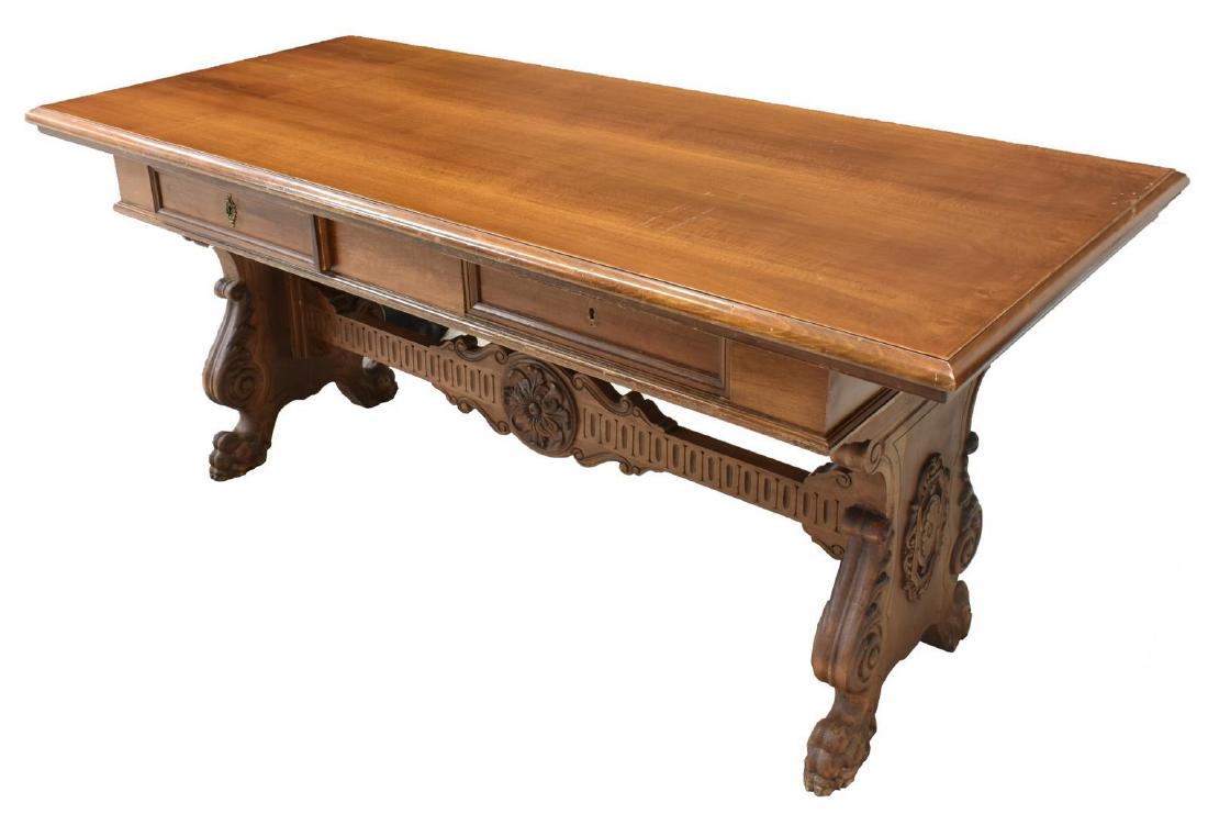 ITALIAN RENAISSANCE REVIVAL LIBRARY TABLE DESK: Italian Renaissance Revival library table/ desk, having rectangular top, over two frieze drawers, trestle supports carved with scrolling foliates, joined by stretcher with central foliate roundel, end