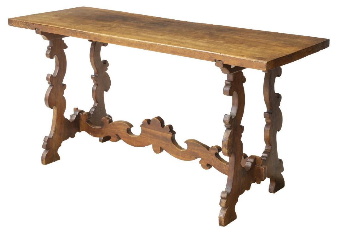 SPANISH BAROQUE STYLE WALNUT CONSOLE TABLE: Spanish Baroque style walnut console table, late 19th/ early 20th c., having single plank top, rising on ox yoke trestle supports, joined by center stretcher, approx 31"h, 62.5"w, 21.75"d Start Price: