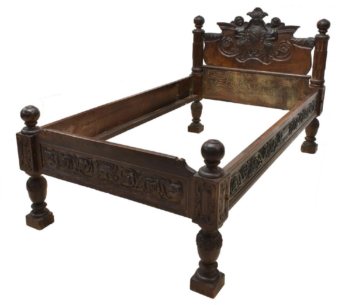 ITALIAN BAROQUE STYLE HEAVILY CARVED BED: Italian Baroque style bed, 19th c., having foliate, floral and grotesque motifs, the headboard heavily carved with angelic figures flanking heraldic crest, accented by fluted standards, round finials 