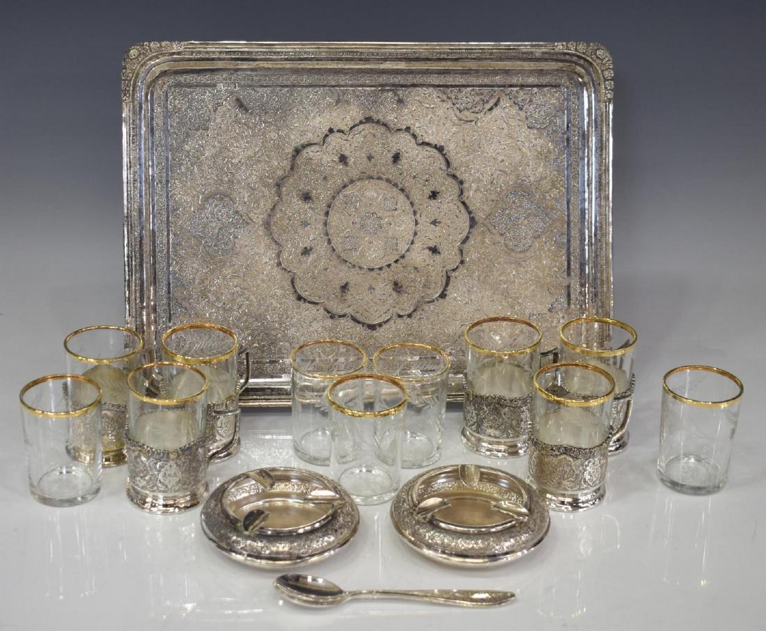 (21) PERSIAN CHASED .875 SILVER CUP HOLDERS & TRAY: (lot of 21) Persian silver tableware group, hallmarked and bearing silver standard mark 84 (.875 silver), including: (6) .875 silver handled cup holders/ sleeves, with chased floral and foliate motif,
