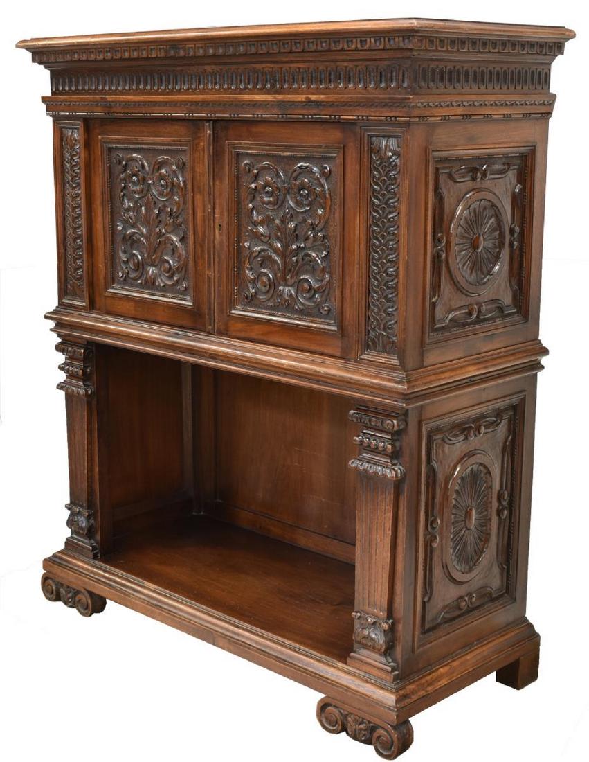 ITALIAN RENAISSANCE REVIVAL WALNUT CABINET: Italian Renaissance Revival walnut cabinet, early 20th c., having cornice top with molding, case fitted with double doors, door fronts with scrolling foliates, paneled sides with floral medallions, st
