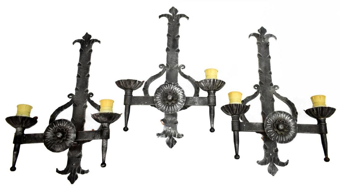 (3) ITALIAN WROUGHT IRON 2-LIGHT WALL SCONCES: (pair) Italian iron two-light wall sconces, 20thc, accented elongated wall bracket perforate with two drill holes at top and bottom, fronted by center bar with floral element, support issuing two ligh