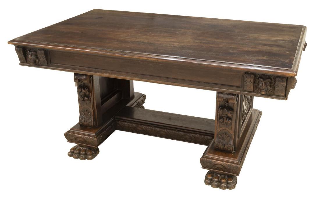 SPANISH RENAISSANCE REVIVAL CARVED WALNUT TABLE: Spanish Renaissance Revival walnut table, late 19th c., having rectangular tabletop with molded edge, apron with carved lion masks and foliate corbels, draw-leaf supports at sides providing drawer sto