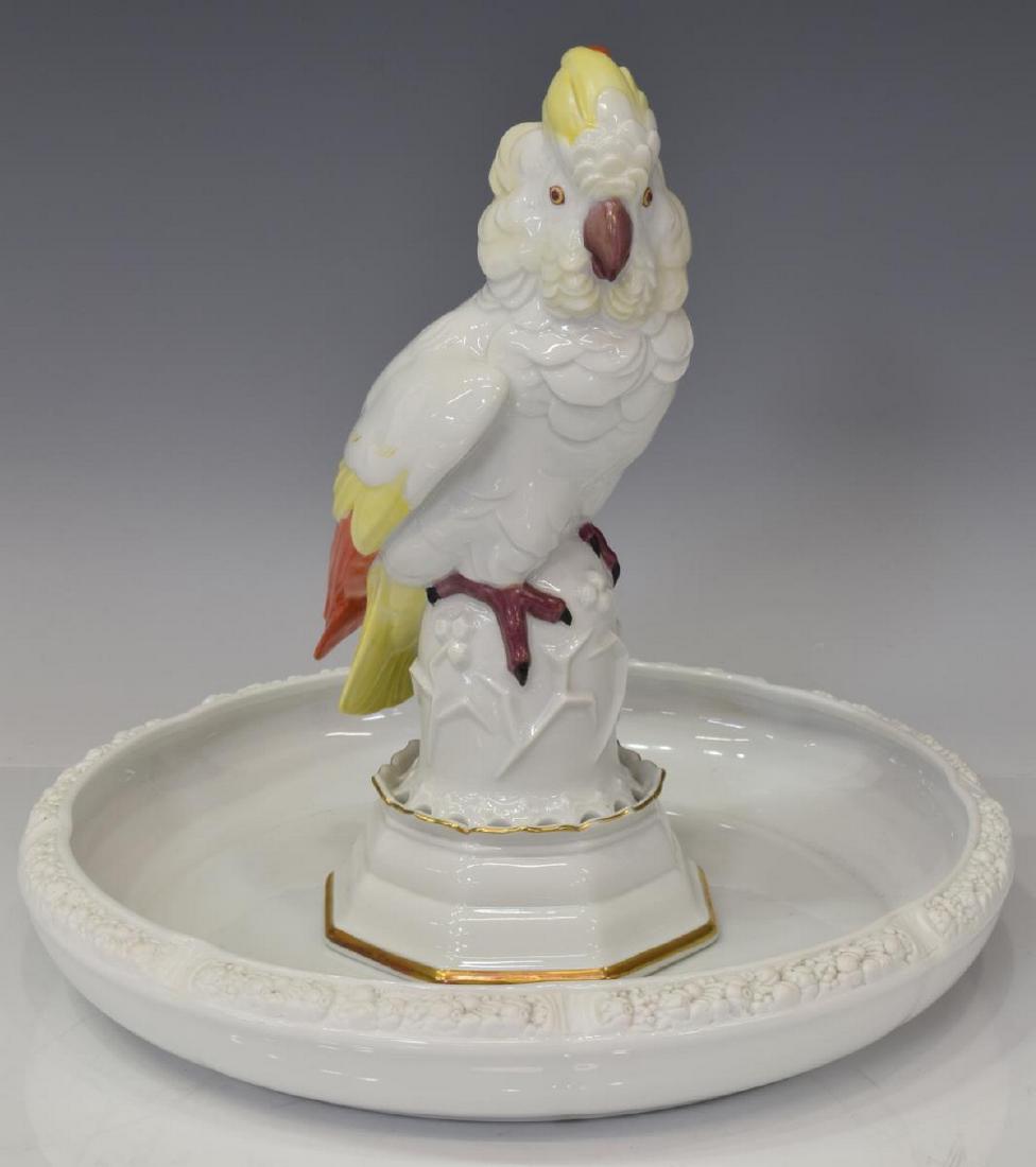 (2) ROSENTHAL PORCELAIN BIRD FROG CENTERPIECE: (lot of 2) Rosenthal porcelain centerpiece, a cockatoo perched on a flowering floral frog base set within matched white center bowl with raised floral rim, largest approx 1.75"h, 11.75"diam; 4.5lbs to