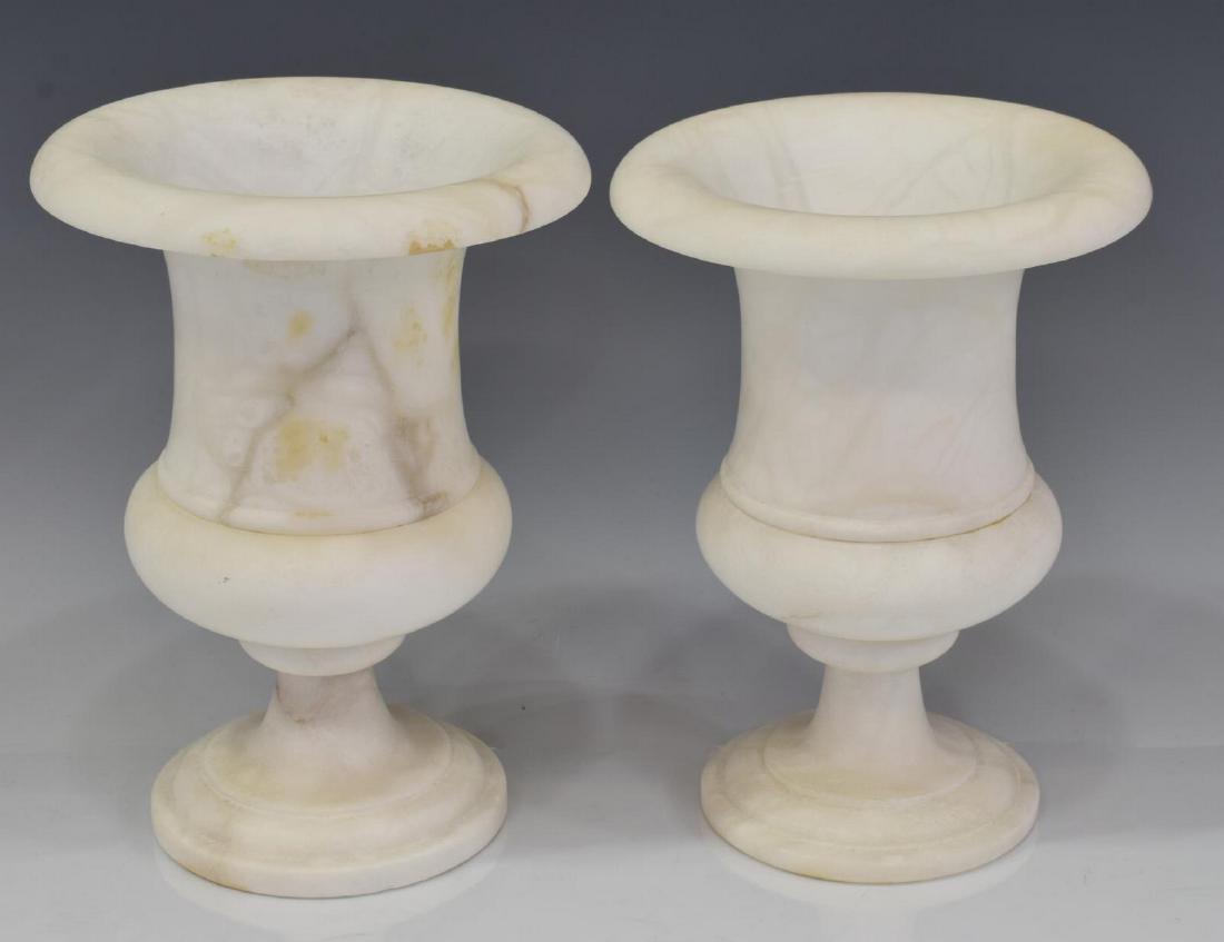 (PR) J.A.Y. SPAIN ALABASTER BOLTED URNS: (pair) Spanish alabaster bolted urns, the campagna- shaped body rising on a stepped circular base, one retaining "J.A.Y. Genuine Alabaster Made in Spain" sticker to underside, each approx 10"h, 7"diam