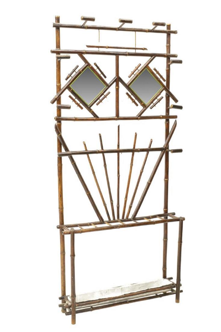 VICTORIAN AESTHETIC MOVEMENT BAMBOO HALLTREE: Victorian Aesthetic Movement bamboo hall tree, early 20thc, two rhombic beveled mirrors, nine hooks, bottom stick stand with seven divisions, approx 73.5"h, 35"w, 9.25"d Start Price: $100.00
