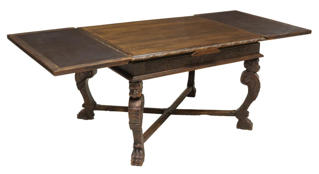 ITALIAN RENAISSANCE REVIVAL EXTENSION DINING TABLE: Italian Renaissance Revival walnut extension dining table, early 20th c., the tabletop accented by running ornamentation, rising on stretcher joined figural carved legs, resting on paw feet, draw leav