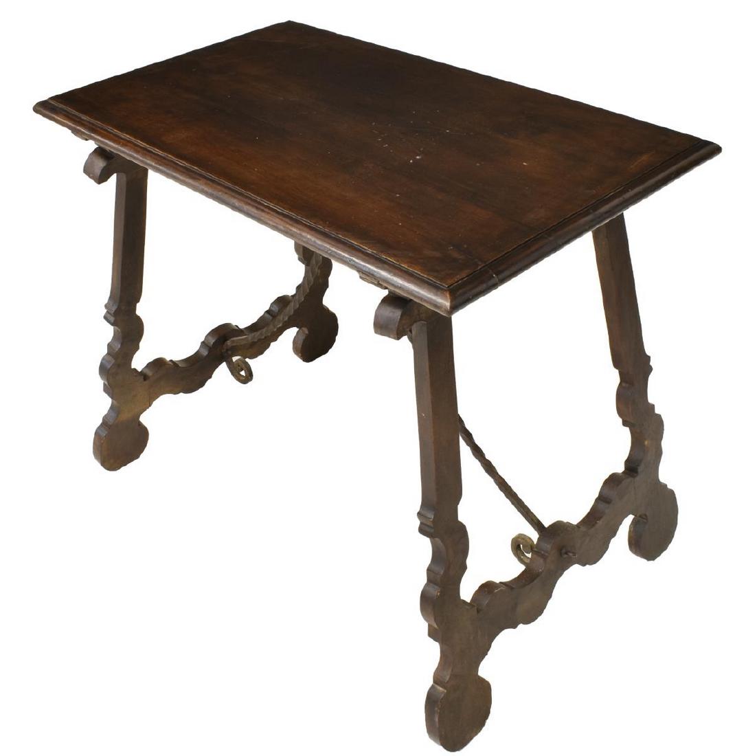 SPANISH BAROQUE STYLE WALNUT SIDE/ WORK TABLE: Spanish Baroque style walnut table, having plank top, rising on ox yoke supports, joined by scrolled and twisted iron center stretcher, approx 30.25"h, 35.75"w, 21.5"d Start Price: $150.00