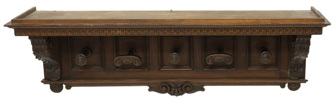 ITALIAN RENAISSANCE REVIVAL WALNUT HAT RACK: Italian Renaissance Revival walnut hat rack, 19th c., having running ornamentation at top, rosette, scrollwork, foliate and shell carving, five hooks, approx 11.5"h, 58"w, 16.5"d Start Price: $100.00