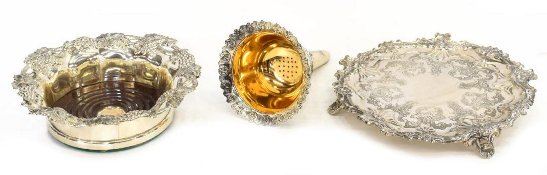 (3) SILVERPLATE WINE FUNNEL, BOTTLE COASTER, TRAY: (lot of 3) Silverplate tableware, including: (1) card tray/ stand, Corbell & Co., rocaille border, raised on three feet, approx 1.25"h, 7 7/8"diam, (1) wine bottle coaster, Corbell & Co., border with