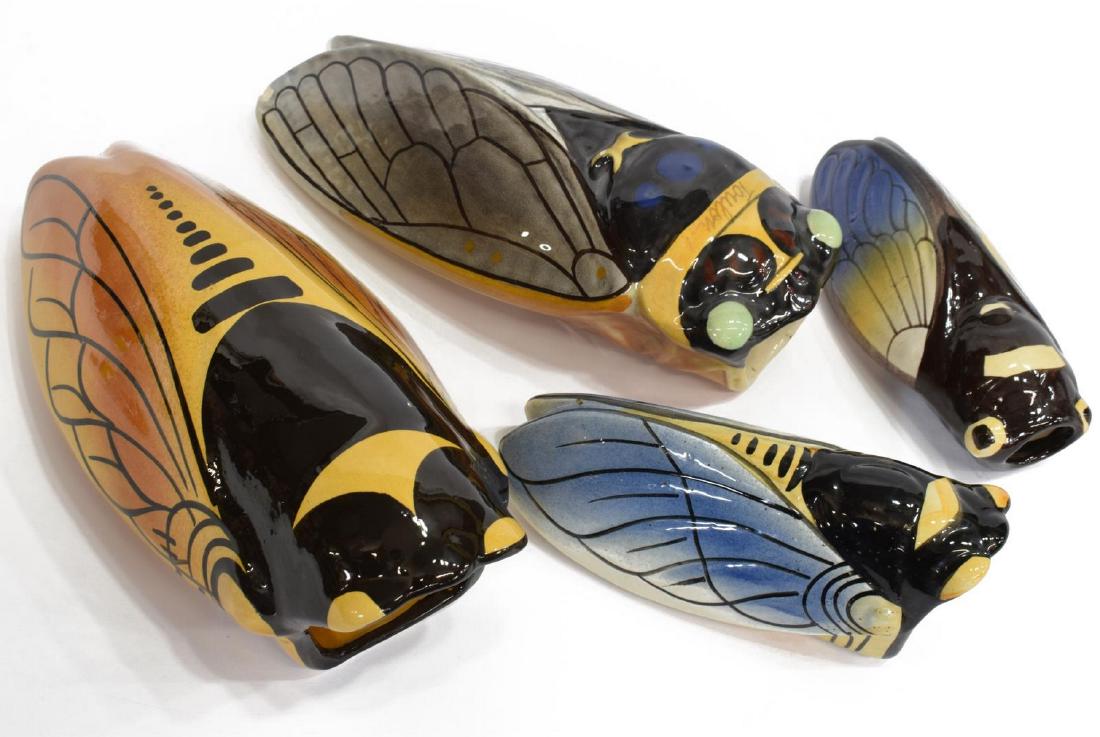 (4) FRENCH POLYCHROME CERAMIC CICADA WALL POCKETS: (lot of 4) French ceramic cicada wall pockets, 20thc., varied designs, (one) marked Vallauris, (one) marked Toulon, grey cicada with small chip to wing, largest: approx 11"h; 4lbs total Start Price: $
