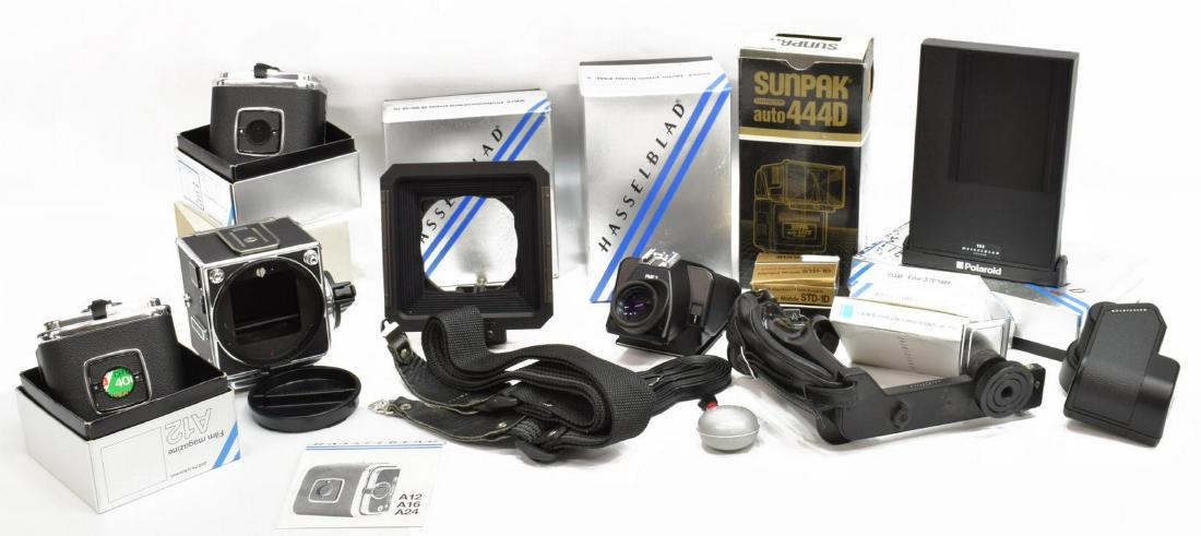 (15) HASSELBLAD 2003FCW CAMERA BODY & ACCESSORIES: (lot of 15) Collection of vintage Hasselblad camera equipment, including: (1) 2003FCW medium format SLR camera body, (1) professional lens shade, 40676, (1) filter, haze, 51349, (2) lens mounting ring