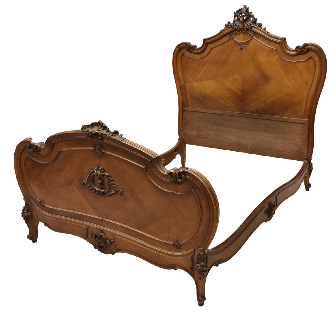 FRENCH LOUIS XV STYLE WALNUT BED: French Louis XV style walnut bed, early 20th c, headboard and footboard in a matched veneer, accented by foliate and rocaille carving throughout head and baseboard, rising on cabriole legs, resting on