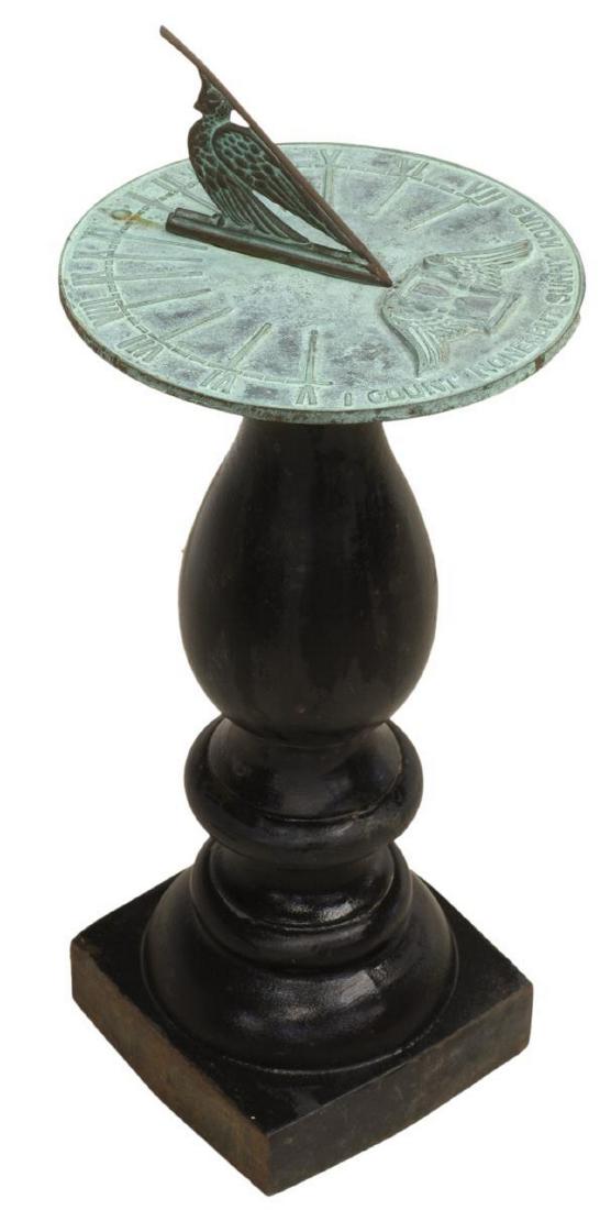 OUTDOOR GARDEN SUNDIAL ON CAST IRON PEDESTAL: Outdoor garden sundial, bird-form gnomon, over circular dial plate in verdigris finish, with winged hourglass, text reading "I count none but sunny hours," marked Virginia Metalcrafters to underside,