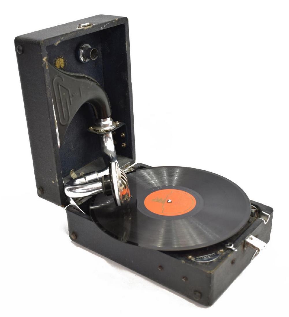 RUSSIAN WINDUP PORTABLE PHONOGRAPH: Russian windup portable phonograph, first half 20th c., including windup crank and reproducer,one Russian 78rpm record, mechanically operates but stops shortly after starting, case: 5.25"h, 10.75"w, 7