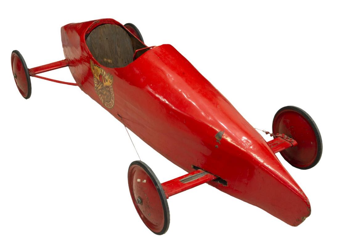 LOYAL ORDER OF MOOSE SOAPBOX DERBY RACE CAR: Soapbox Derby race car, in bright red paint, P.A.P. Loyal Order of Moose moniker on each side, with functioning steering wheel, approx 24"h, 81"l, 31"d Start Price: $100.00