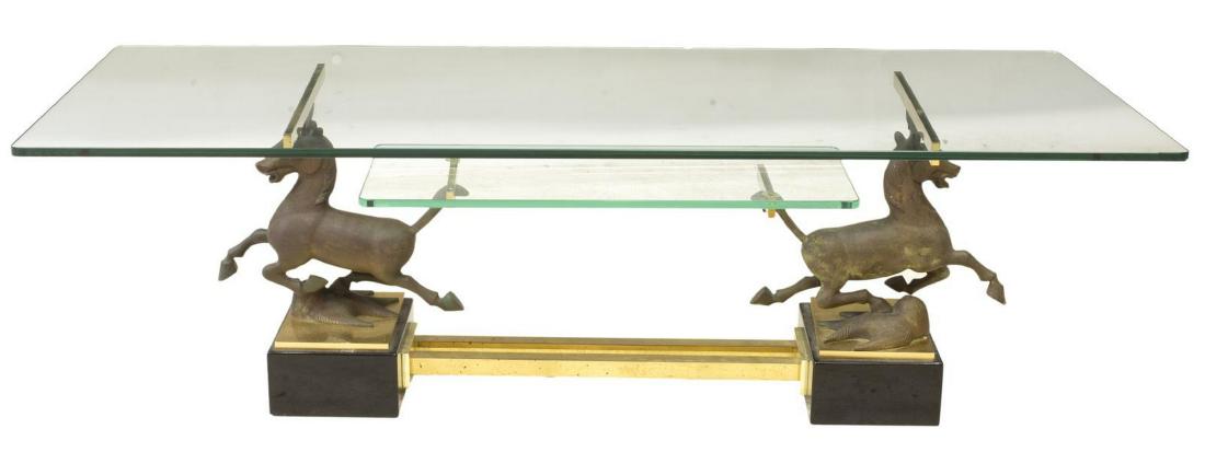 MAISON CHARLES ATTRIB. GLASS & BRONZE COFFEE TABLE: Italian bronze and glass center table, mid 20th c., unmarked, attributed to Charles Maison, having glass top, with smaller glass shelf below, supported by bronze horse form standards, resting on black