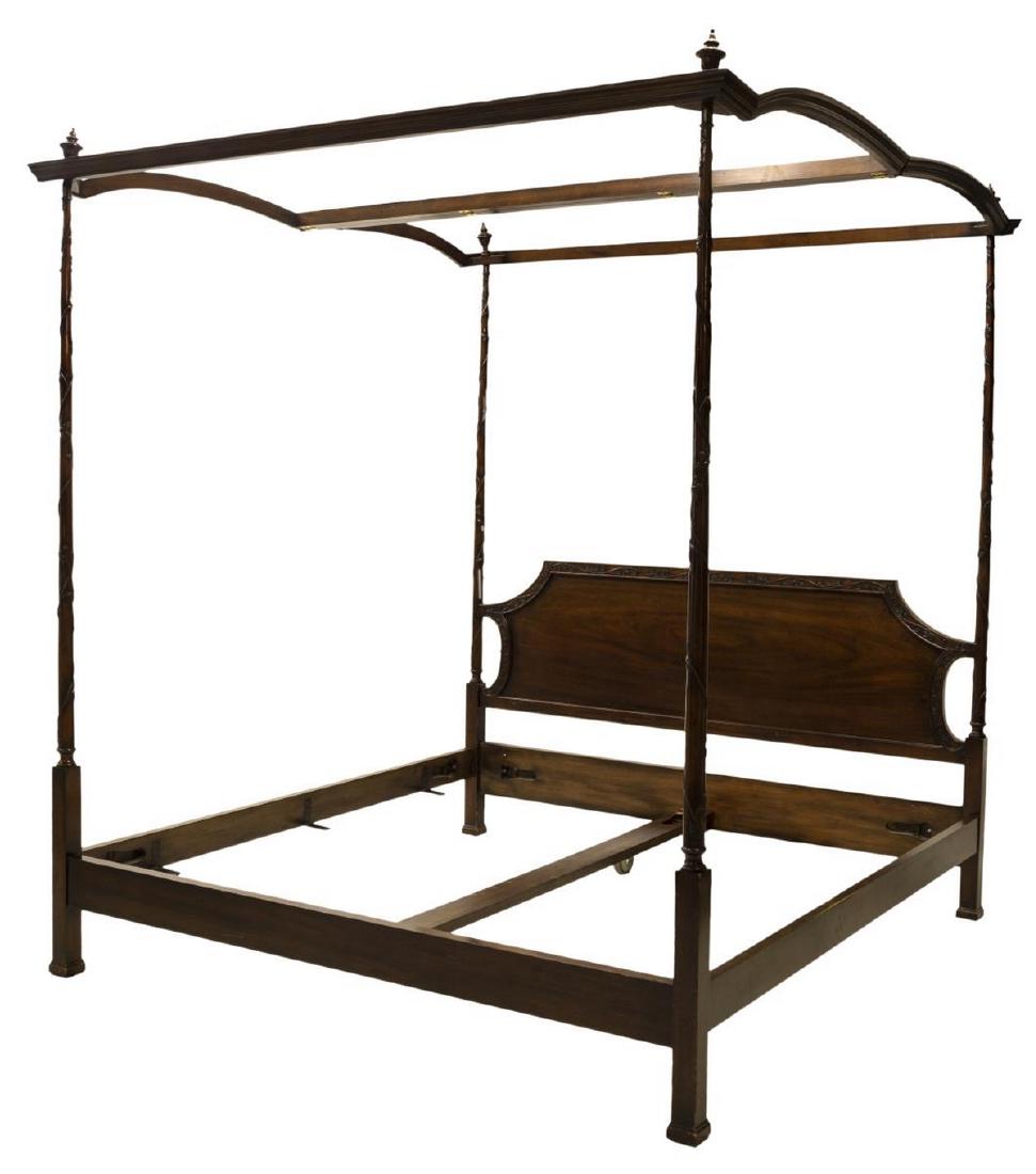 CARVED FOUR-POST PLANTATION STYLE CANOPY BED: Carved four-post plantation style king size canopy bed, in a mahogany finish, with foliate and vine carving to the headboard and posts, scattered surface wear, exterior: 92.5"h, 81.5"l, 86"d, interior