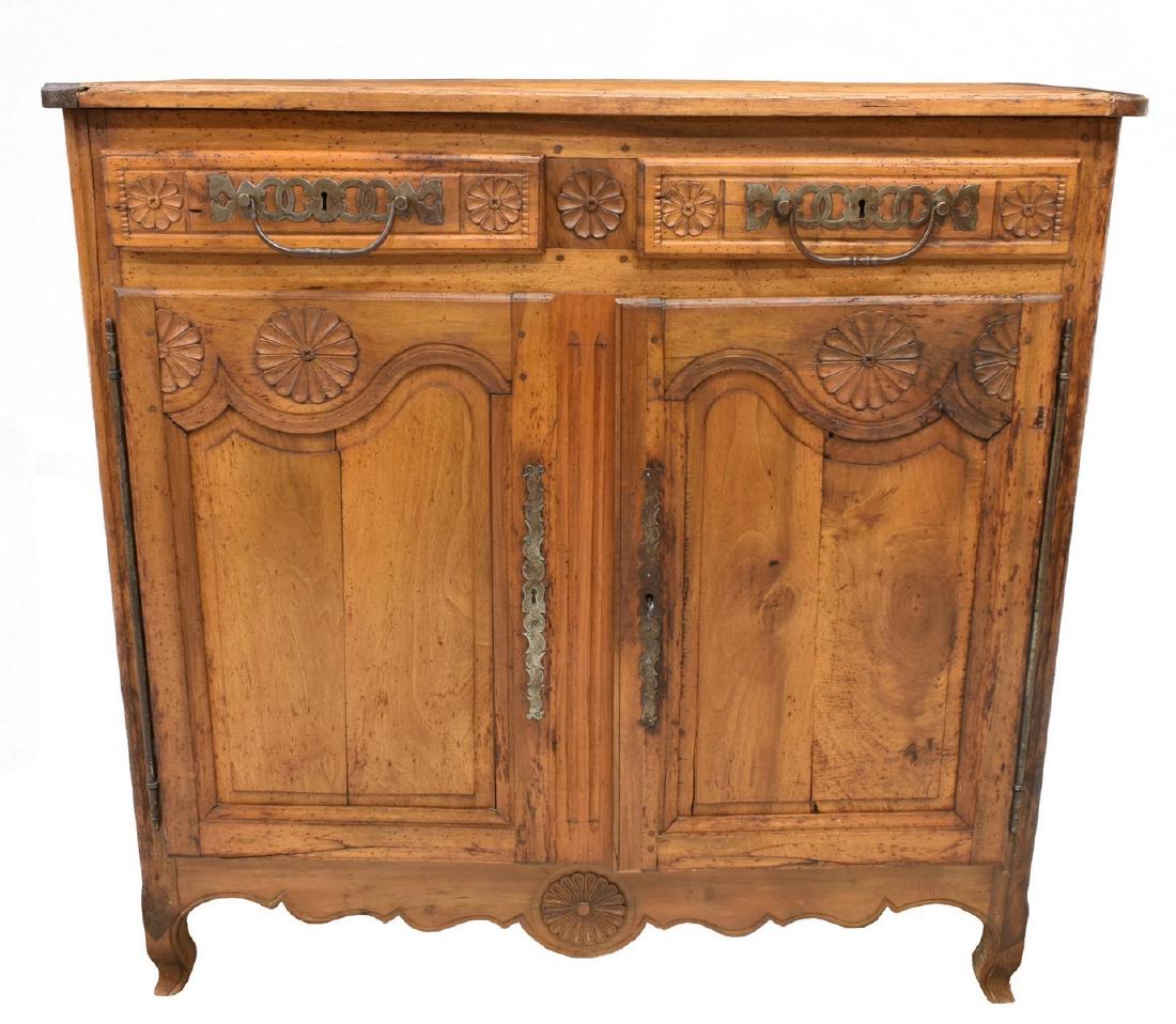FRENCH LOUIS XV STYLE BUFFET, 18TH C.: French Louis XV style walnut buffet, 18th c., having rosette carving, accented by bold iron hardware, two drawers above single double door cabinet, fitted to interior with two shelves, rising on cabri