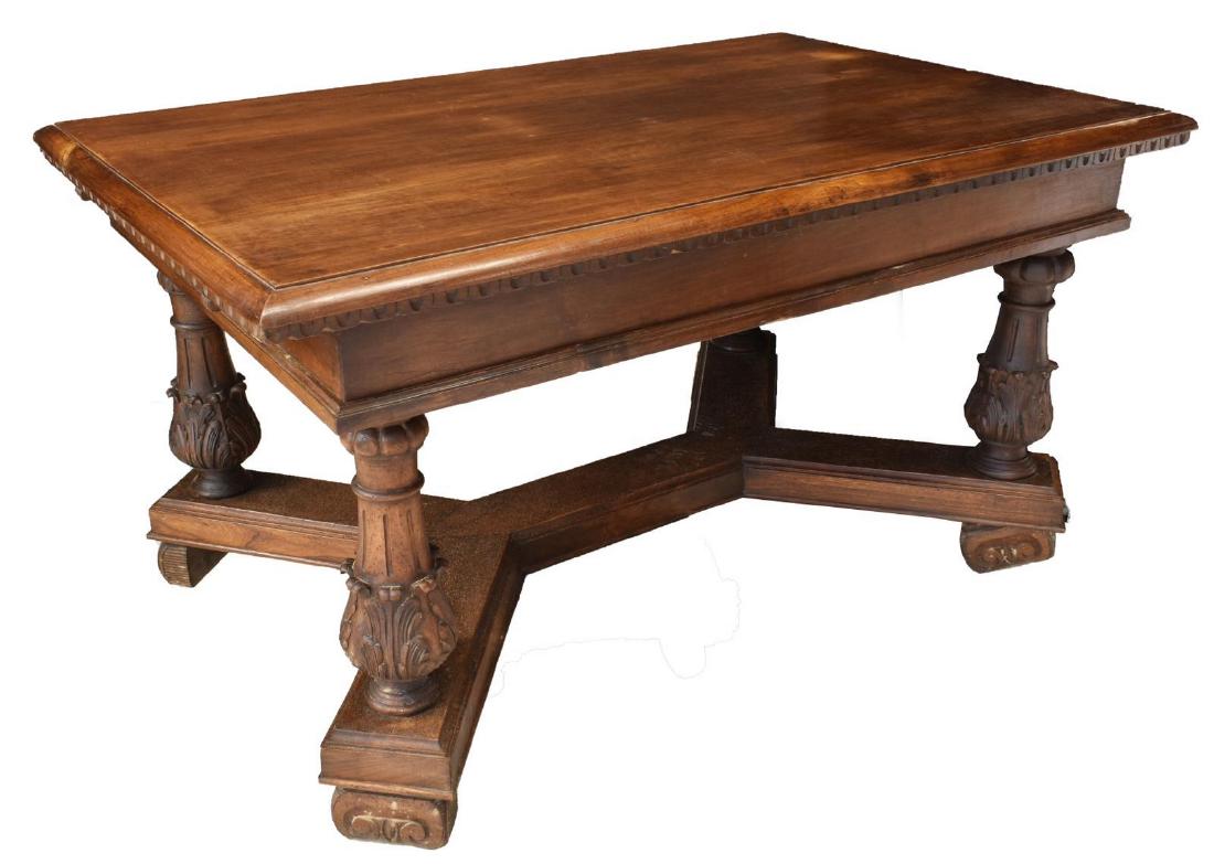 CONTINENTAL RENAISSANCE REVIVAL WALNUT TABLE: Continental Renaissance Revival walnut table, late 19th c., rectangular top with decorative scoop molding, vasiform supports with carved foliate band, stretcher-joined trestle base, on volute feet, ap