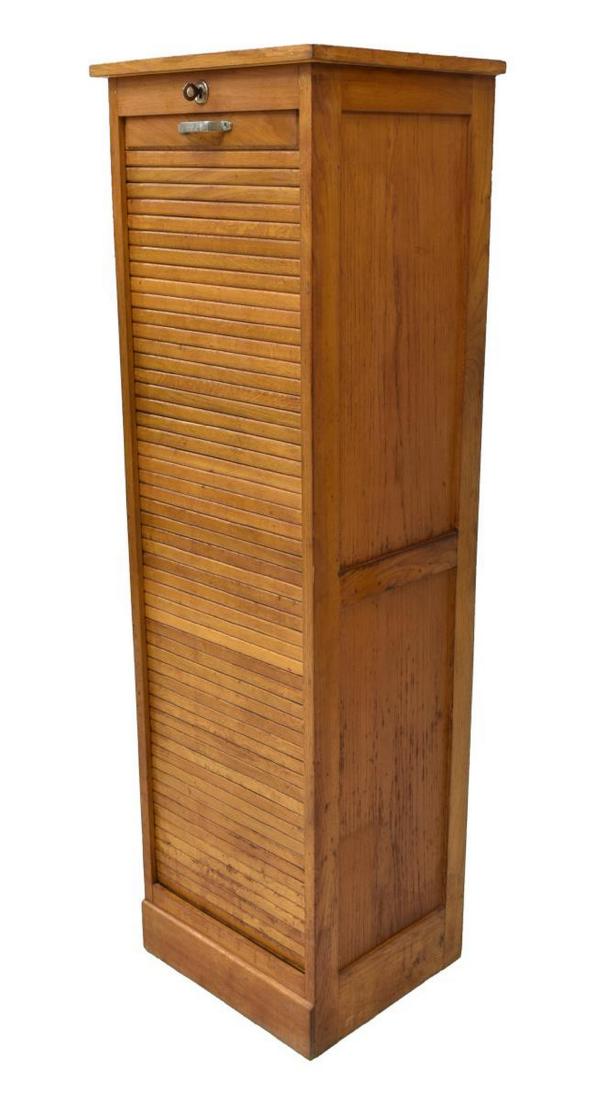 FRENCH OAK TALL TAMBOUR DOOR FILE CABINET: French oak file cabinet, mid 20th c., tall rectangular case, with tambour door, opening to interior shelves, plinth base, partial paper label for furniture marker verso, approx 59"h, 18"w, 15.75"d Sta