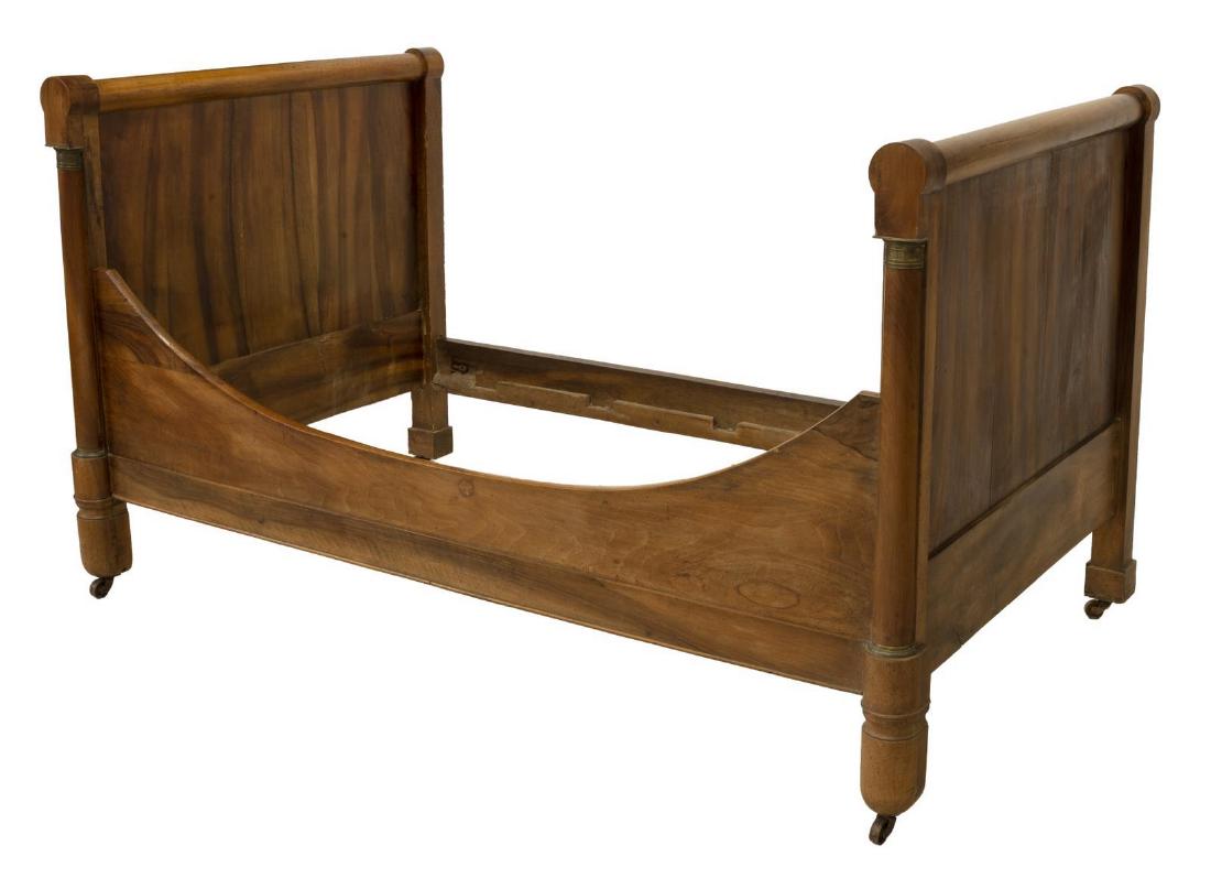 FRENCH EMPIRE STYLE WALNUT ALCOVE BED, 19TH C.: French Empire style walnut alcove bed, mid 19th c, having gilt metal accents to headboard and footboard at outer side, wood worming throught, small losses to wood, exterior: approx 43.5"h, 45"w, 75.5"