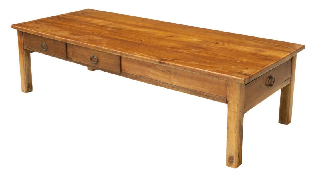 FRENCH FRUITWOOD LONG COFFEE TABLE: French fruitwood coffee table, early 20th c., the long rectangular table with two drawers to one side, single sectioned drawer at one end, on reduced legs (originally a work/dining table), approx 19.7