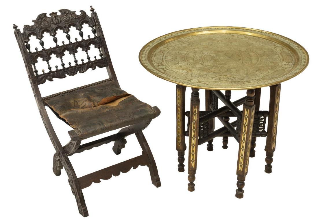 2)CONTINENTAL FOLDING CHAIR & ARABESQUE TRAY TABLE: (lot of 2) Furniture group, including; (1) brass and wood tray table, India, gilt metal showing incised arabesque geometrical designs, circular top, resting on a six part collapsible wood base, approx