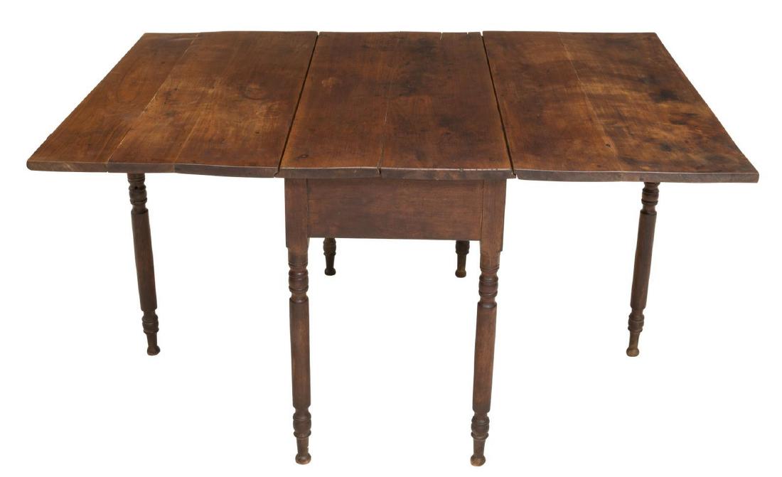 AMERICAN DROP LEAF TABLE: American drop leaf table, 20th c., the rectangular top resting on six turned legs, one foot with loss, restoration to tabletop, approx 29.75"h, 21"w, 46.75"d; open: 60.25"w **Provenance: From the Esta
