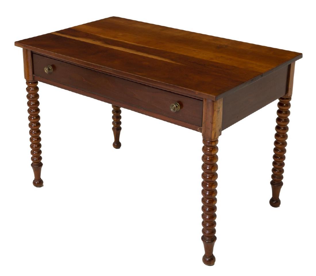 AMERICAN CHERRY WORK TABLE BOBBIN TURNED LEGS: American cherry work table, 19th c., rectangular top, over single frieze drawer, rising on bobbin turned legs, resting on ball feet, approx 29.25"h, 42.5"w, 26"d **Provenance: From the Estate of Unive