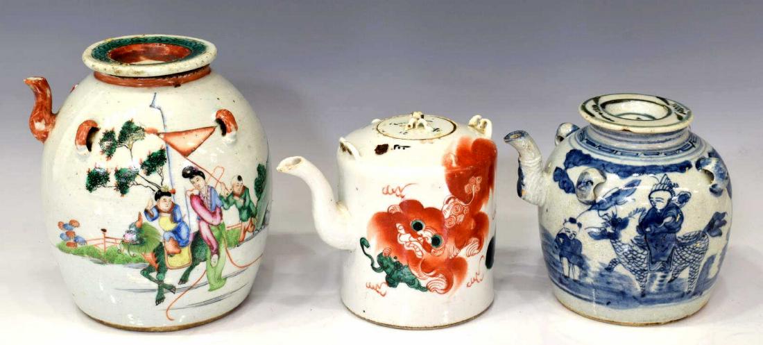 (3) COLLECTION OF CHINESE PORCELAIN TEAPOTS: (lot of 3) Chinese porcelain teapots, including (1) painted with characters and foo lion, retaining seal to top, loss to handle join, 5.5"h, 7"w, 5"d; (1) blue and white, painted character to lid at c
