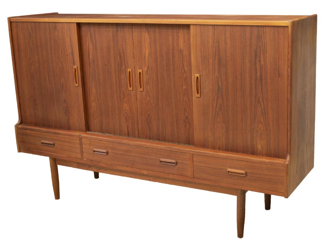 DANISH MID-CENTURY MODERN TEAK SIDEBOARD: Danish mid-century modern teak sideboard, c.1950s, having three cabinets, the left with single sliding door opening to two shelves, the center with double sliding doors and single shelf, the right wit